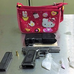Gun, bag of drug, taser and red Hello kitty kid bag